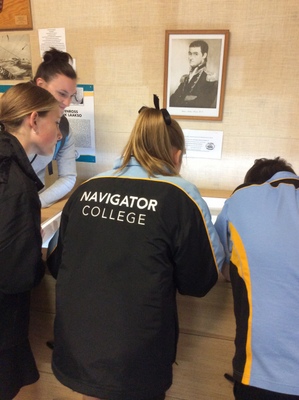visitors viewing Matthew Flinders display