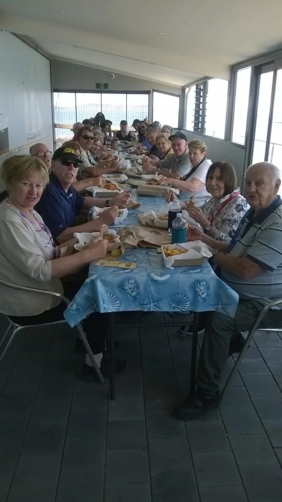visitors eating takeaway on the Verandah